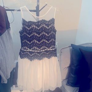 Formal white dress w/designed black fabric.